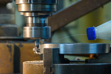 The slot cutting process on NC milling machine with T-slot tool tools.