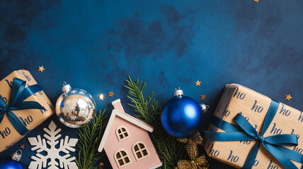 Festive Christmas Decorations with Gift Boxes and Baubles against Blue Background