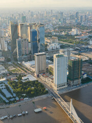 Obraz premium Modern residential areas and office buildings with Tonle Sap river in the background in rapidly developing Phnom Penh city panorama, Cambodia