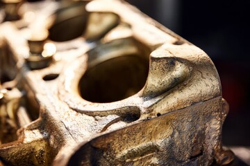 Close-up of a vintage engine block showcasing intricate detail and rugged texture, highlighting classic automobile design and engineering excellence.