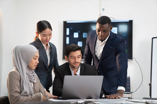 team of multiethnic colleague discuss budget performance planning, sharing idea for cost reduction, business people man woman diverse employee coworker in formal suit meeting in finance office - Powered by Adobe