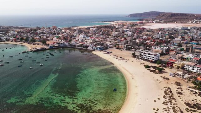 Aerial view of Sal Rei, Old city with many colorful house, turquoise ocean and sandy beach, background the desert,Boa Vista, Cape Verde