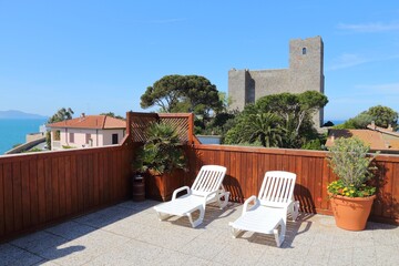 Rocca di Talamone - Talamone Castle in Tuscany, Italy, seen from a rooftop terrace.