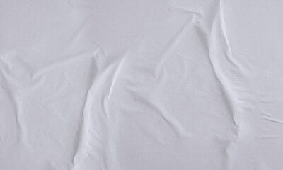 Folded white paper texture backdrop, crumpled poster surface, empty background for text or graphics