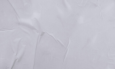 Folded white paper texture backdrop, crumpled poster surface, empty background for text or graphics