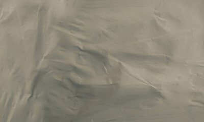 Folded white paper texture backdrop, crumpled poster surface, empty background for text or graphics