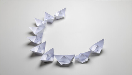 Strategic paper boats arranged in circle symbolize peace and dialogue on white background with soft lighting