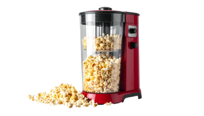 Red popcorn maker overflowing with popped kernels on black background
