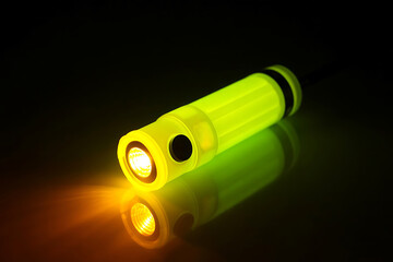 Radiant Yellow LED Flashlight Shining Bright Against a Soft Dark Background