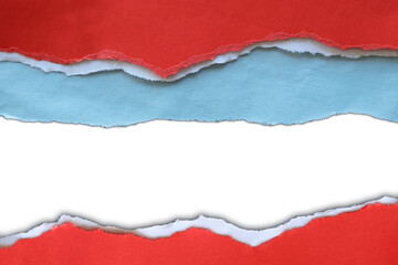 Torn red and blue paper on white
