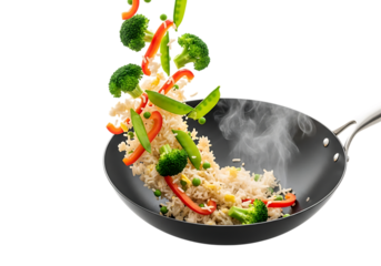 Fresh vegetable and rice mixture being tossed into a steaming hot black wok isolated on transparent background