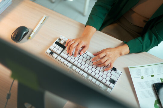 Woman hands typing keyboard, working late office computer