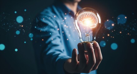 Person holds glowing lightbulb with brain inside against dark backdrop with blue lights. Represents creative thinking, smart solutions, and new ideas. Perfect for innovation and business content.