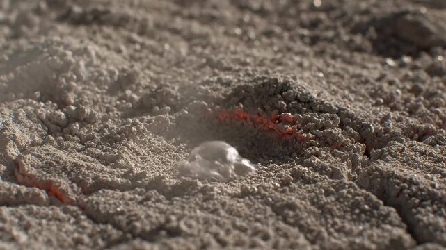 Abstract macro shot of volcanic activity with water interaction, creating a visual effect