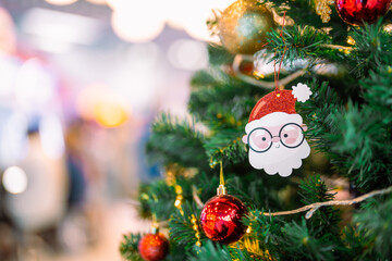 Closeup garland Christmas tree decoration,red,gold,silver ornament with bokeh background. Perfect holiday sales, winter celebration, festive seasonal promotions, marketing, shopping with copy space