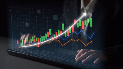 A business professional reviews financial data on a computer, showcasing upward trends with colorful graphs and charts that emphasize market analysis and growth strategy. Copula