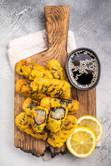 Gimmari, korean deep fried snack, seawed rolls and noodles glass. grey background. top view