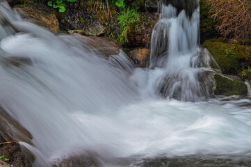 Fototapeta premium close-up of small waterfall along the creek San Nicolò inside San Nicolò valley, Val di Fassa, Dolomites, Italy