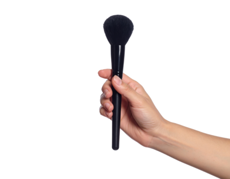 close-up photograph of a hand holding a large, black, professional powder or blush makeup brush.