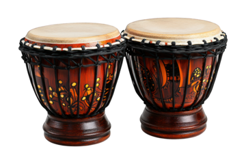 Two ornate, ethnic drums with skins and rope binding, against a dark background