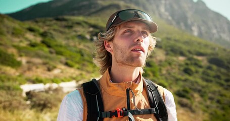 Man, hiker and break with water on mountain for outdoor adventure, exploration or sightseeing. Hydration, male person or mineral liquid with rest or aqua beverage for trekking journey in nature