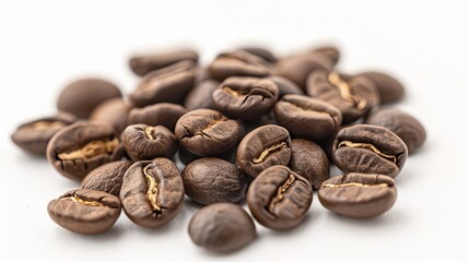 Naklejka premium Close up of roasted arabica coffee beans on a white background for coffee lovers and enthusiasts