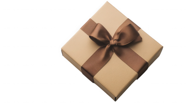 A tan gift box with a brown ribbon and bow sitting on a black background in a studio setting on transparent background