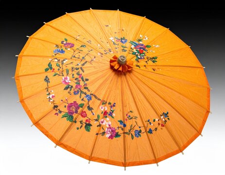 Orange paper umbrella with floral paintings