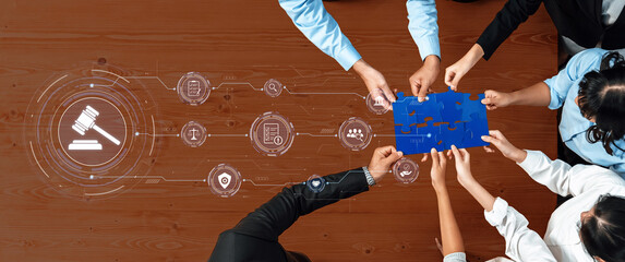 A diverse group engages in a collaborative meeting, focusing on legal solutions through a puzzle piece, surrounded by digital icons representing justice and data concepts. Trope