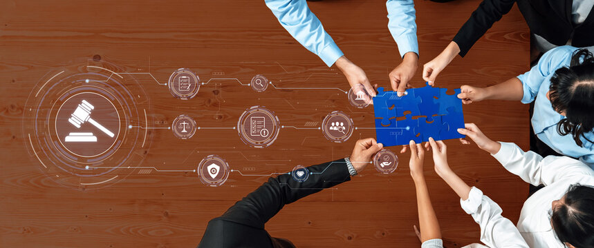 A diverse group engages in a collaborative meeting, focusing on legal solutions through a puzzle piece, surrounded by digital icons representing justice and data concepts. Trope