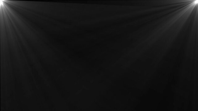 Two corner spotlights casting rays of light downwards and inwards on a dark background beam shine