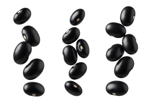 Several glossy black beans appear to be falling or floating against a pure transparent background, showcasing their smooth texture and oval shape