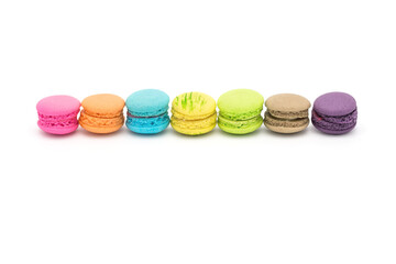 Colorful mini macaroons isolated on white background