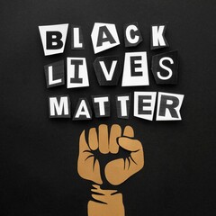 Black lives matter message displayed with cut out letters above a raised fist on a dark background