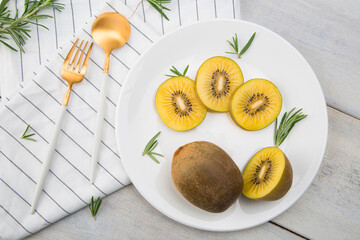 Fresh Chile Gold Kiwi fruit isolated on Wooden background