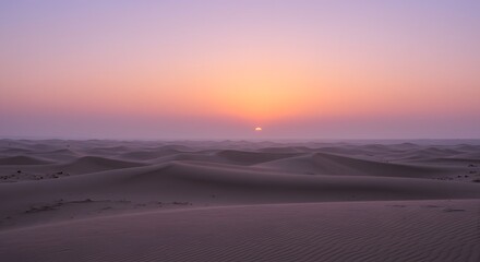 Obraz premium The soft, pastel colors of dawn over the desert.
