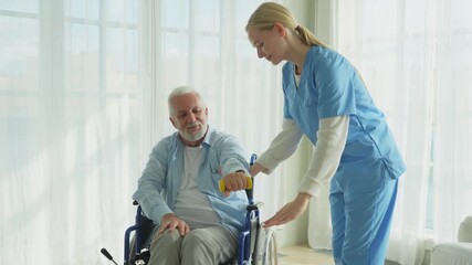 Support rehabilitation healthcare. Nurse helps old man patient in wheelchair picking up dumbbells. Paralyzed man in chair for people with disability doing sports exercise with nurse. Medical caregiver - Powered by Adobe