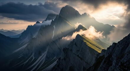 Dramatic sun rays piercing through dark clouds illuminating rugged mountain peaks at sunset or sunrise