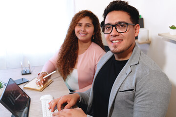 Smiling business professionals working together in a modern office setting