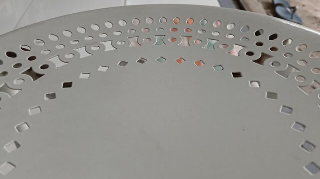 A macro video capturing a large, distinctive yellow and black striped insect resting on a textured gray wall. This insect is a type of crane fly (family Tipulidae), often mistakenly called a mosquito