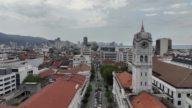 day time penang island george town cityscape traffic street abandoned hotel tower aerial panorama 4k malaysia