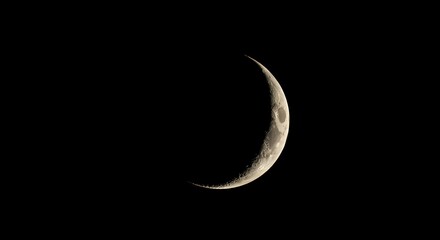 The sharp, crisp outline of a crescent moon.