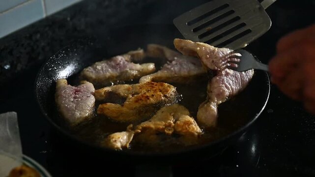 Close-Up of Hands Frying Corvina Fish, Cooking and healthy recipes Seafood