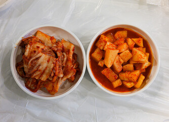 Kimchi and Kkakdugi Side Dishes in Ceramic Bowls
