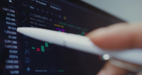 Person using a stylus to analyze cryptocurrency trading chart on a digital tablet, displaying market trends and financial data in close-up. - Powered by Adobe