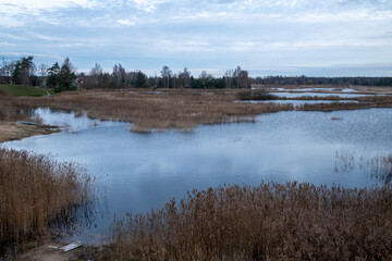 Latvia landscape with old sand and gravel quarry pond. Jelgava, Ruļļu karjers