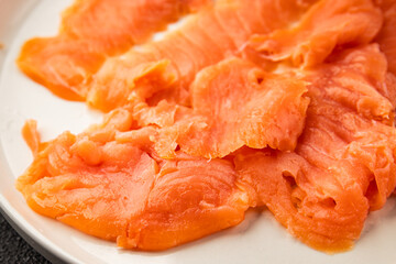 Smoked salmon fish seafood portion size natural product tasty snack fresh delicious gourmet food background on the table rustic top view copy space pescetarian diet