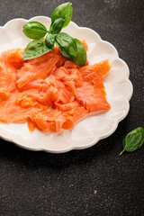 Smoked salmon fish seafood portion size natural product tasty snack fresh delicious gourmet food background on the table rustic top view copy space pescetarian diet