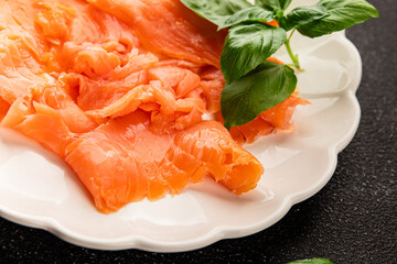 Smoked salmon fish seafood portion size natural product tasty snack fresh delicious gourmet food background on the table rustic top view copy space pescetarian diet