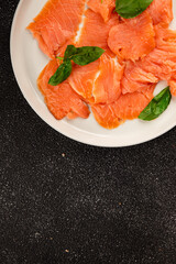 Smoked salmon fish seafood portion size natural product tasty snack fresh delicious gourmet food background on the table rustic top view copy space pescetarian diet